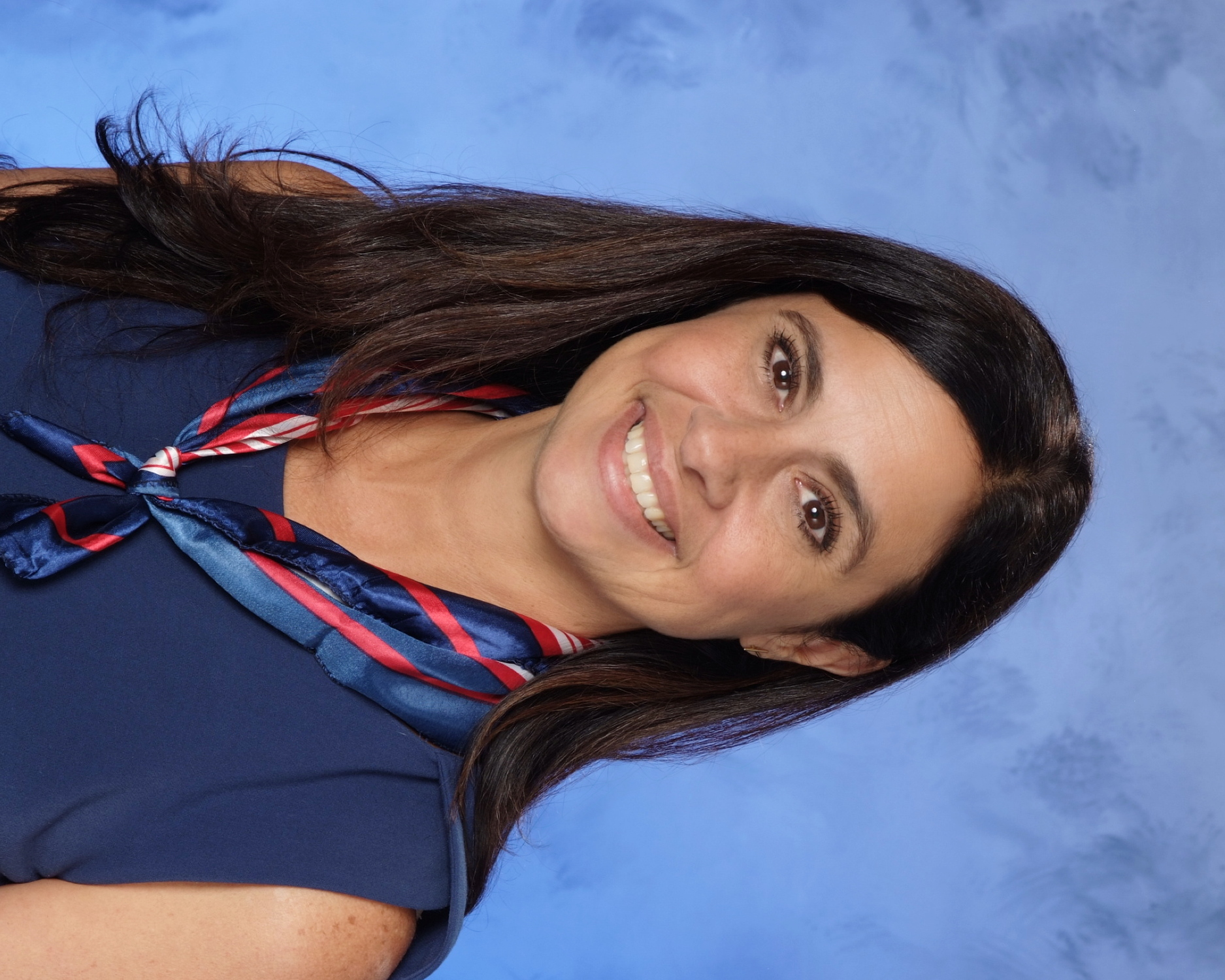 A person smiling for the cameraDescription automatically generated with medium confidence
